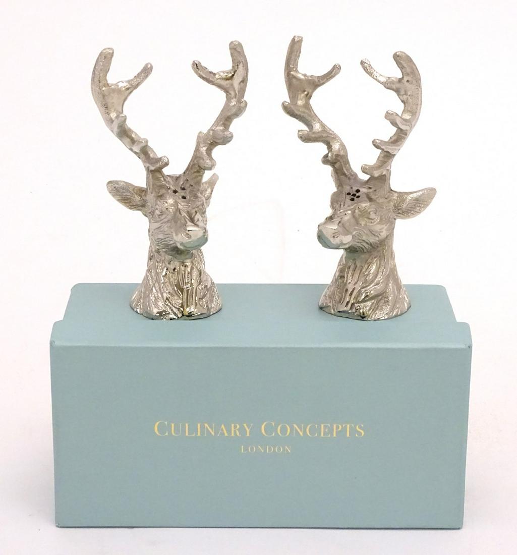 A Culinary Concepts cruet set in the form of stag: A Culinary Concepts cruet set in the form of stag heads, with original box, approx. 5 1/2'' high.
