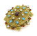 A gilt metal brooch set with moonstone turquoise and