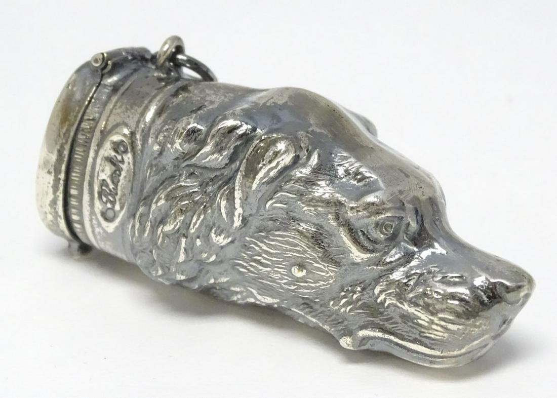 A novelty silver plate vesta case formed ad a dogs: A novelty silver plate vesta case formed ad a dogs head. 2 1/2'' long