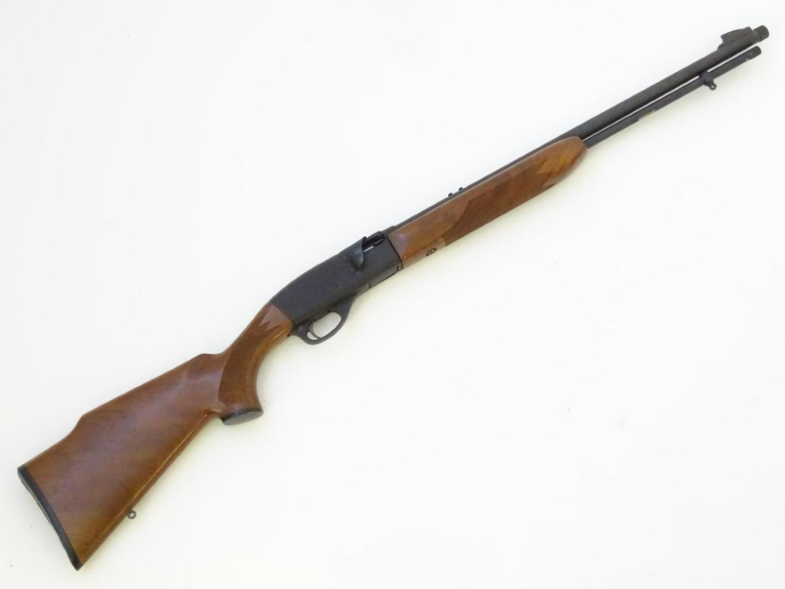 Firearm: a Remington 'Speedmaster Model 552' .22LR: Firearm: a Remington 'Speedmaster Model 552' .22LR semiautomatic rimfire rifle, 21 1/2'' barrel, threaded for a sound moderator and fitted with open foresight. Tube magazine. Two-piece figured walnut 