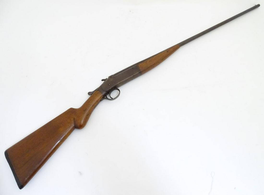 Shotgun: an Iver Johnson .410 single barrel toplever: Shotgun: an Iver Johnson .410 single barrel toplever hammergun, 28'' barrel with bead sight and 2 3/4'' chamber, beech semi-pistolgrip stock with 14 1/4'' LOP. Serial number 62527 Please note: Release