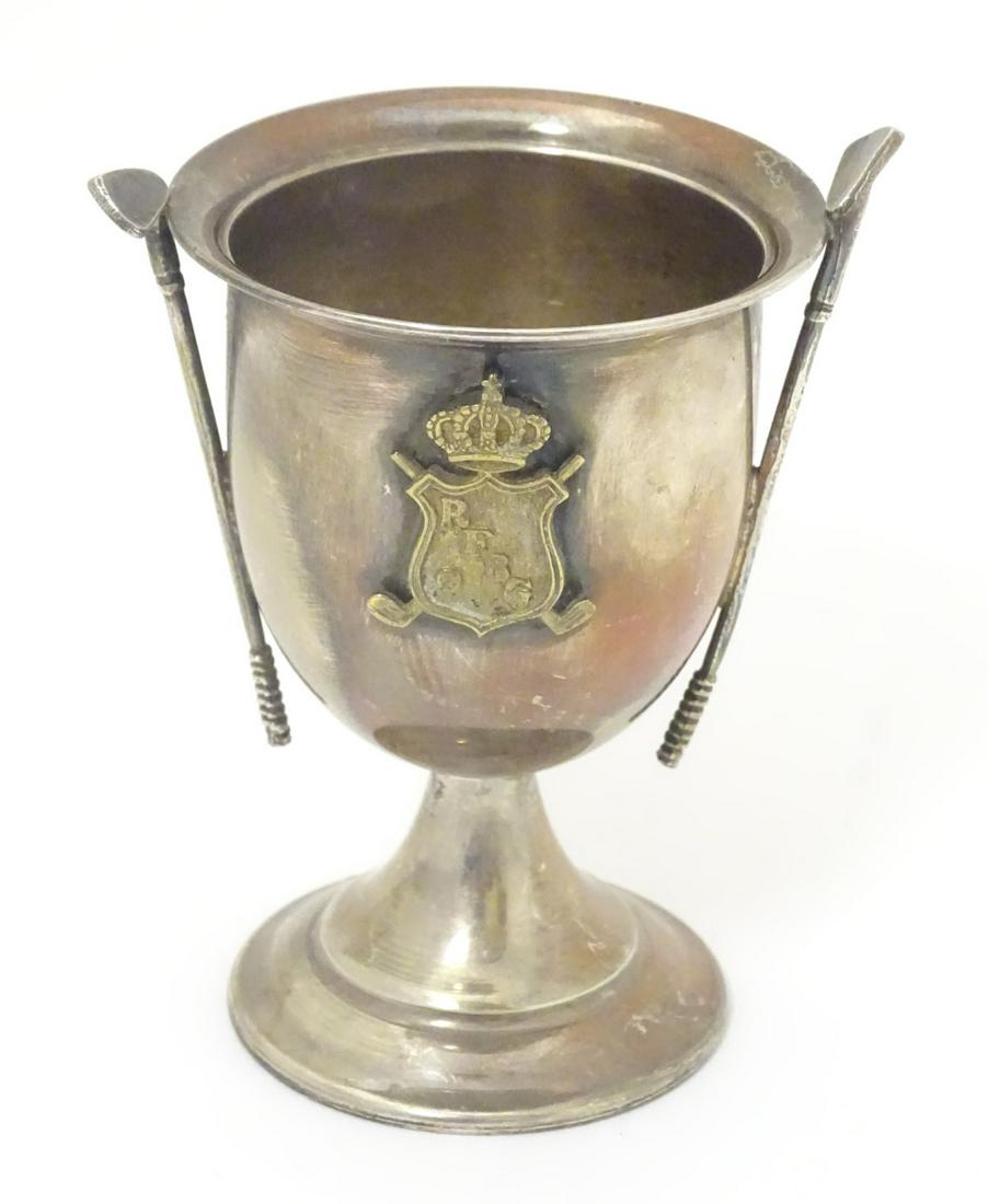 A Silver pedestal trophy cup with gold club decoration: A Silver pedestal trophy cup with gold club decoration and having shield crest titled RFBG 3 1/2'' high