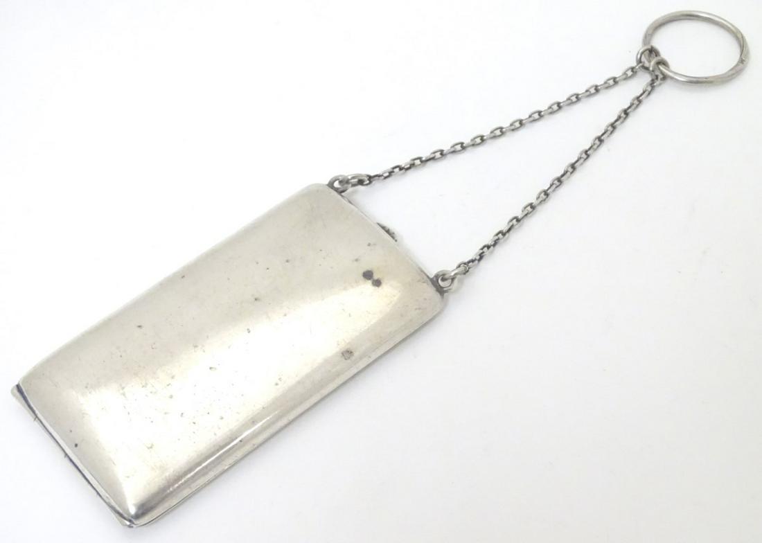 A small silver cheroot case with hanging chain.: A small silver cheroot case with hanging chain. Hallmarked Birmingham 1920 maker William Henry Sparrow. 3 1/4'' x 1 3/4''