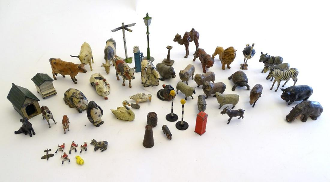 Toys: A quantity of lead farm and zoo animals, many by: Toys: A quantity of lead farm and zoo animals, many by Britains Ltd., together with a kennel, chicken coop, roadside accessories such as lampposts, sign posts, etc. Approx. 50 pieces.