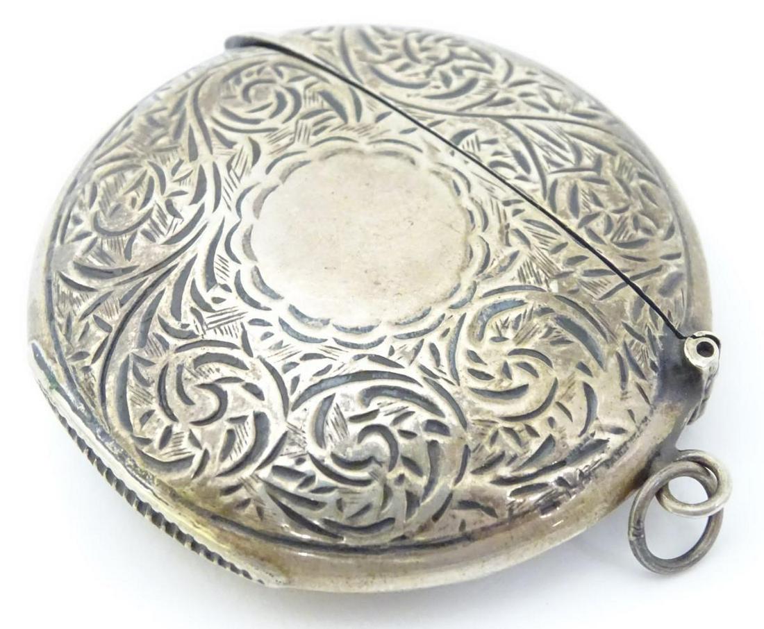 A silver vesta case of circular form with hinged lid.: A silver vesta case of circular form with hinged lid. Hallmarked Sheffield maker David Scott-Walker Approx 2" wide