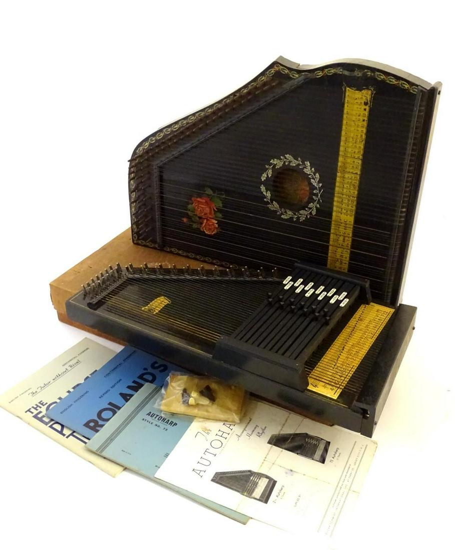 Musical Instruments: a mid 20thC Autoharp by Oscar: Musical Instruments: a mid 20thC Autoharp by Oscar Schmidt, New Jersey USA, together with an early 20thC Concert Mandolin Zither. The largest 21 1/2'' long.