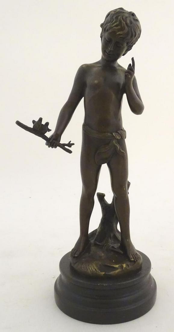 A 20thC cast scultpure depicting a young boy holding a: A 20thC cast scultpure depicting a young boy holding a branch with two small birds, Charmeur after Auguste Moreau (1834-1917). Signed A Moreau. Raised on a marble base. Approx. 15" high overall.