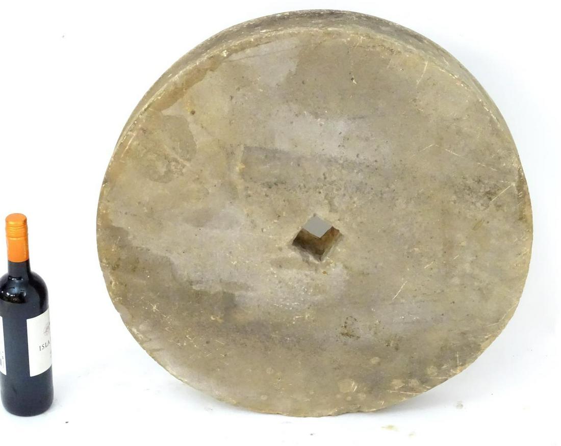 Garden & Architectural: An old millstone wheel. 23": Garden & Architectural: An old millstone wheel. 23" diameter, central void 2 1/2" x 2 1/2"