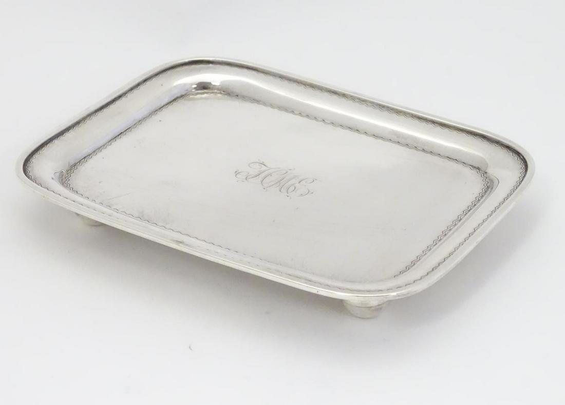A Geo III silver teapot stand hallmarked London 1807: A Geo III silver teapot stand hallmarked London 1807 maker Alice & George Burrows. 6" x 4 1/2" (186g)