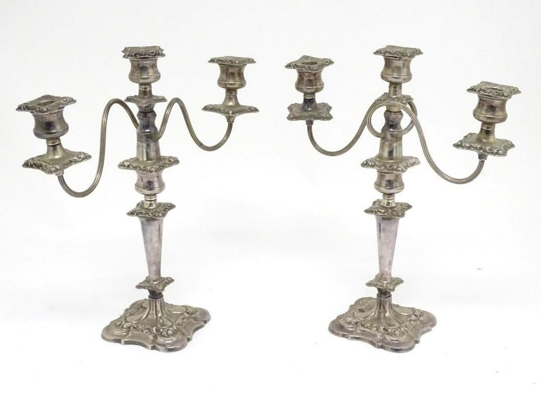 A pair of silver plate three branch table candelabra /: A pair of silver plate three branch table candelabra / candelabrum. Approx. 16 1/2" high. (2)