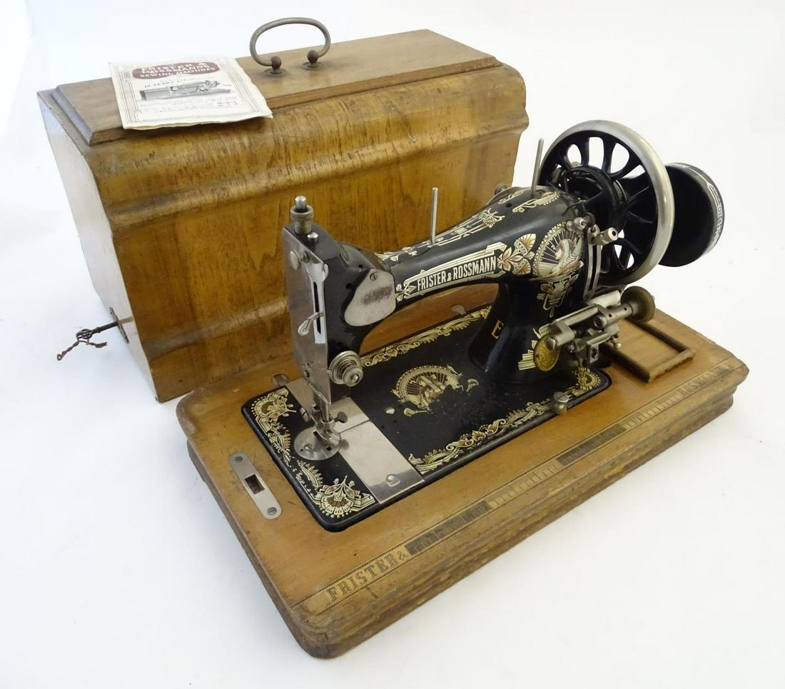 An early 20thC portable sewing machine by Frister and: An early 20thC portable sewing machine by Frister and Rossman, walnut base and case, 19" long