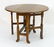 A late 19thC oak gateleg table, having drop flaps - 6