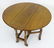 A late 19thC oak gateleg table, having drop flaps - 7