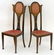 A pair of early 20thC Art Nouveau chairs with shaped