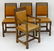 A set of four oak Arts and Crafts style dining chairs - 4