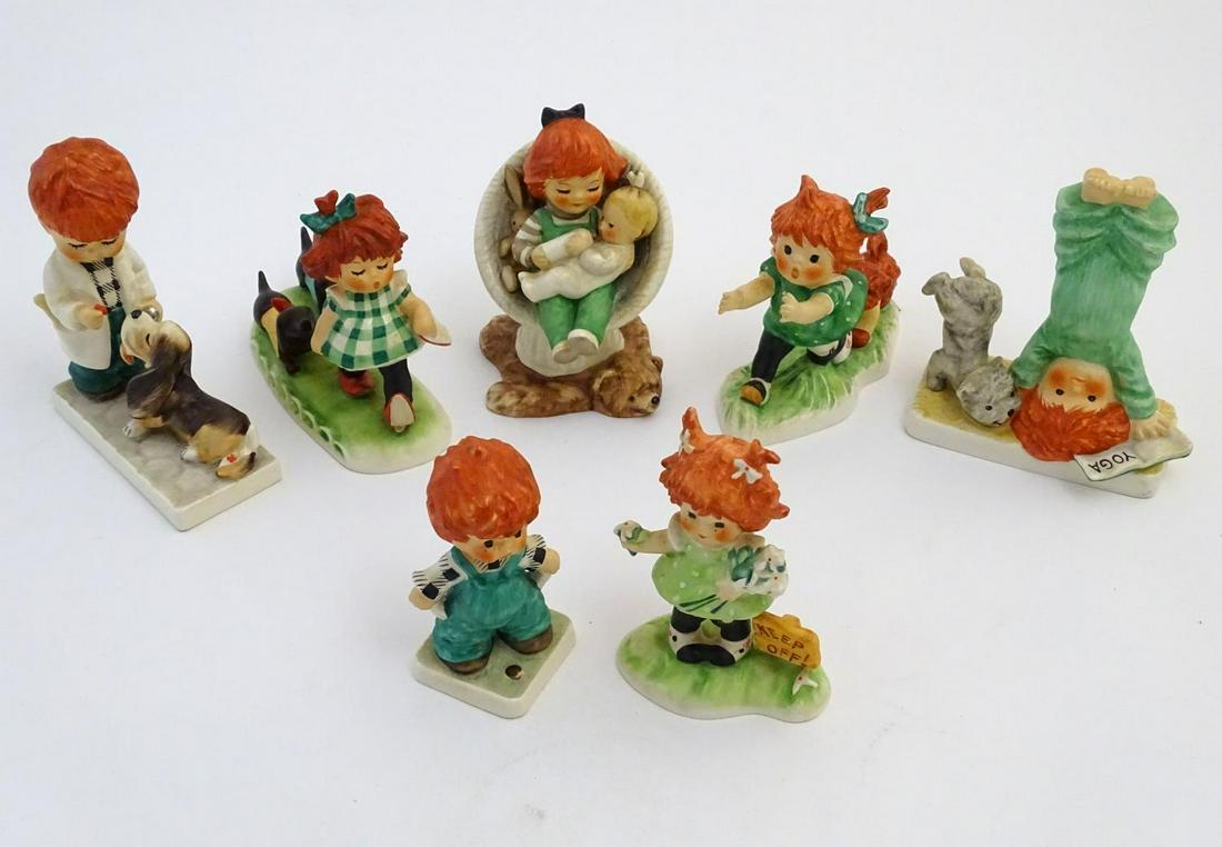 Seven Goebel Red head figures by Charlot Byj,: Seven Goebel Red head figures by Charlot Byj, comprising Say A-A-A-Ahh, a red haired boy dressed as a vet with a dog, model no. 68; Daisies Won't Tell, a redhead girl with flowers on bank of grass wit