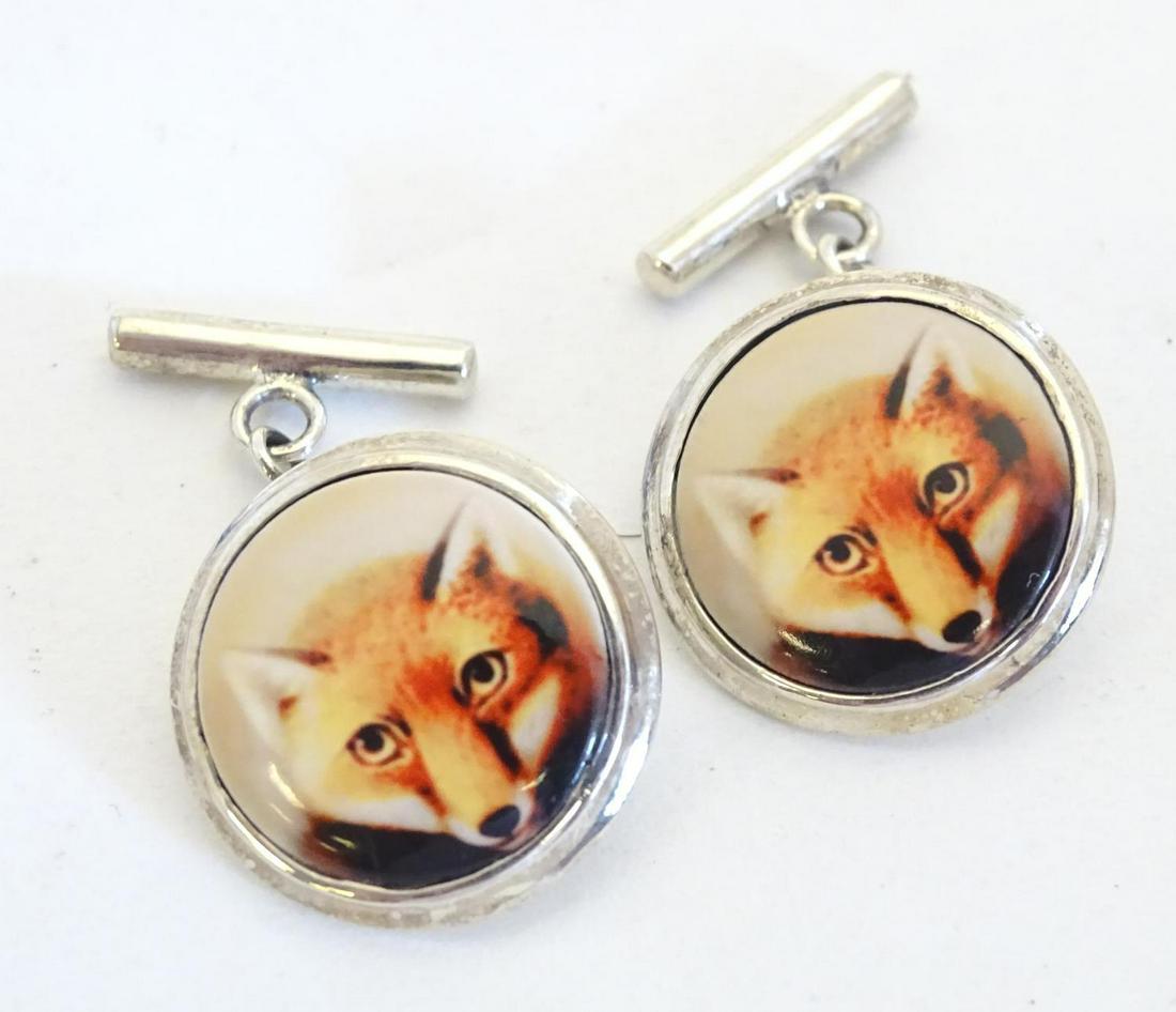 Silver cufflinks with cabochon detail with fox head: Silver cufflinks with cabochon detail with fox head decoration 3/4" diameter Condition Report Please Note - we do not make reference to the condition of lots within descriptions. We are however happy 