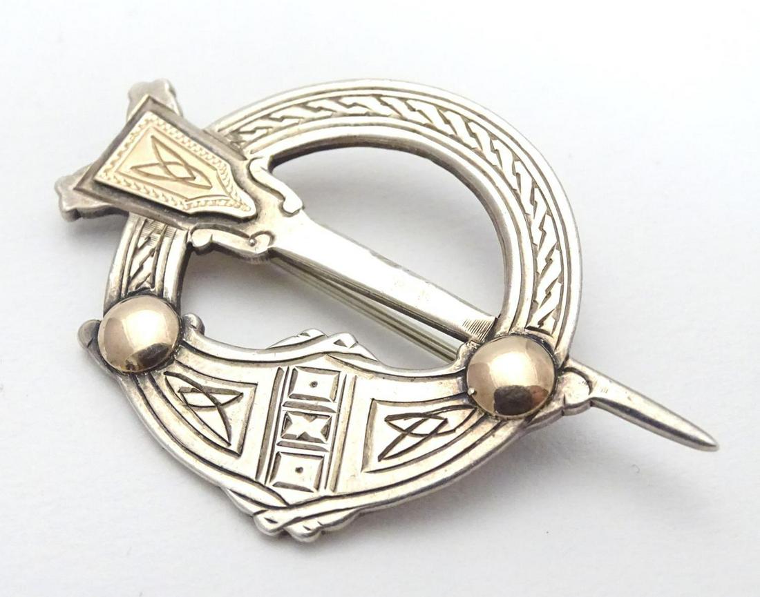 An Irish silver Tara kilt-pin of Pseudo Penannular form: An Irish silver Tara kilt-pin of Pseudo Penannular form with gilt detail. Hallmarked Dublin 1960 maker P.A possibly Patrick Archer. 2" wide