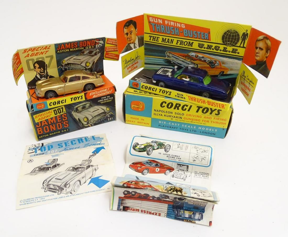 Toys: Two Corgi Toys die cast scale model cars: Toys: Two Corgi Toys die cast scale model cars comprising Gun Firing Thrush-Buster from the film The Man from U.N.C.L.E, model no. 497, with figures of Napoleon Solo driving and firing, and Illya Kury