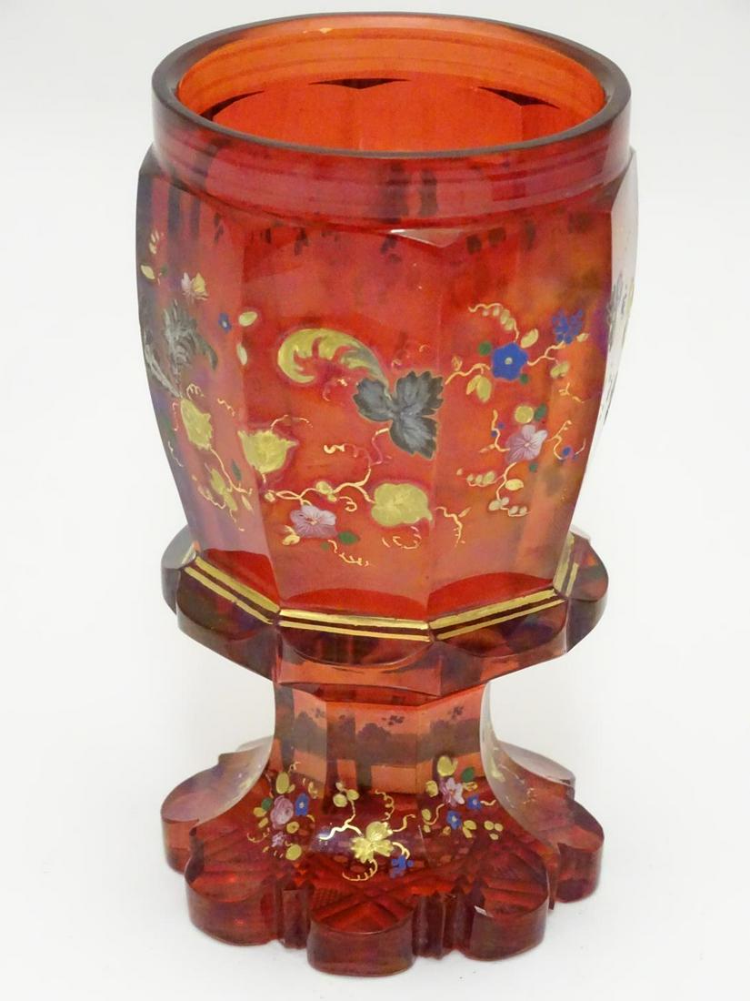 A 19thC bohemian wine glass decorated with floral: A 19thC bohemian wine glass decorated with floral decoration and gilt highlights. 5 5/8" tall