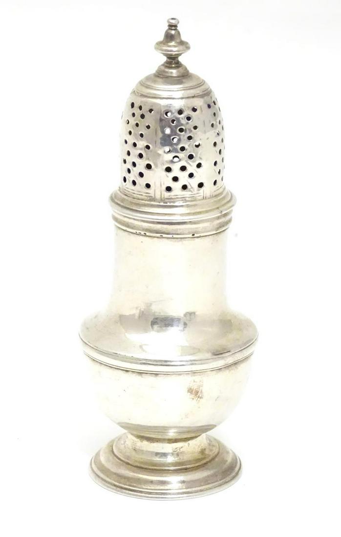 A silver pepperette / caster hallmarked London 1745: A silver pepperette / caster hallmarked London 1745 maker Samuel Wood. Approx 5" high