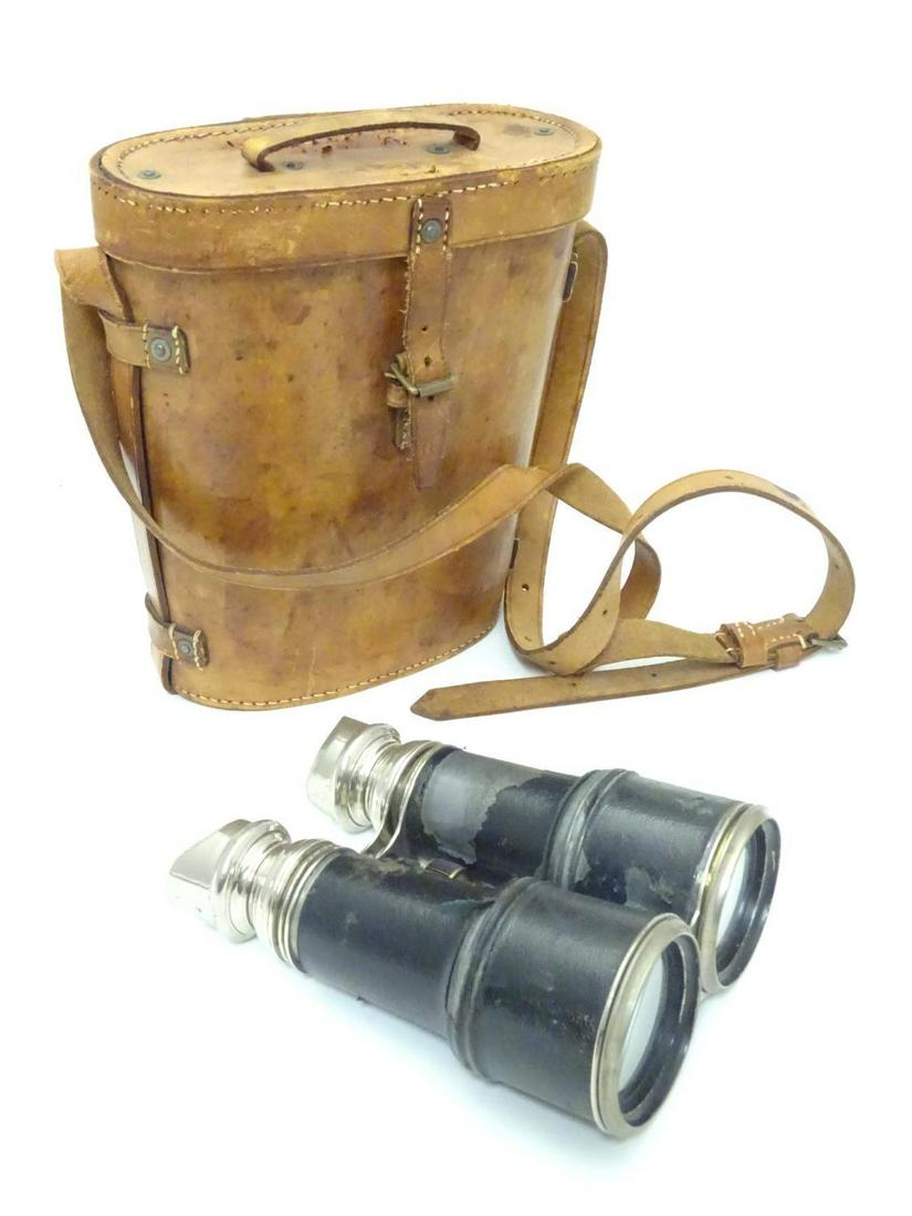 A pair of Binoculars / Field Glasses by Chevalier,: A pair of Binoculars / Field Glasses by Chevalier, Paris, with sunshades and associated leather case