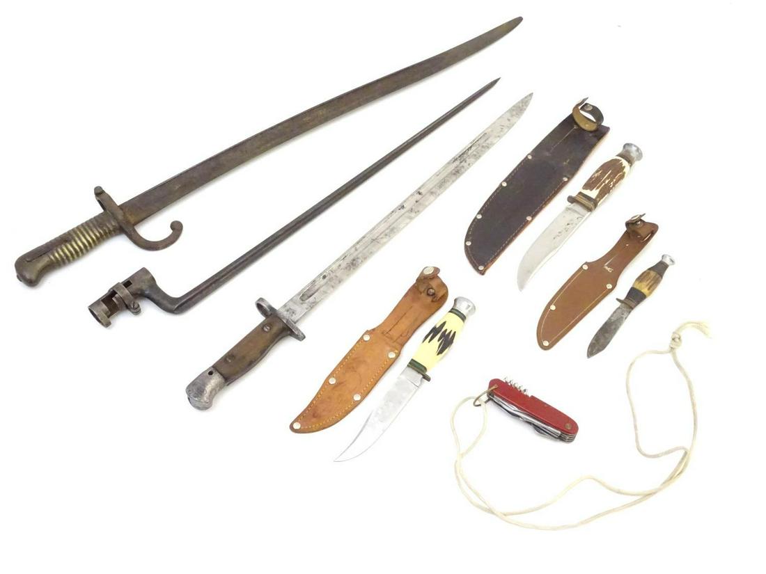 Militaria: three early 20thC bayonets, comprising a: Militaria: three early 20thC bayonets, comprising a French Yataghan sword bayonet, a socket bayonet with lebel type blade, and an Anderson 1907 pattern bayonet with MoD and war acceptance stamps. Toge