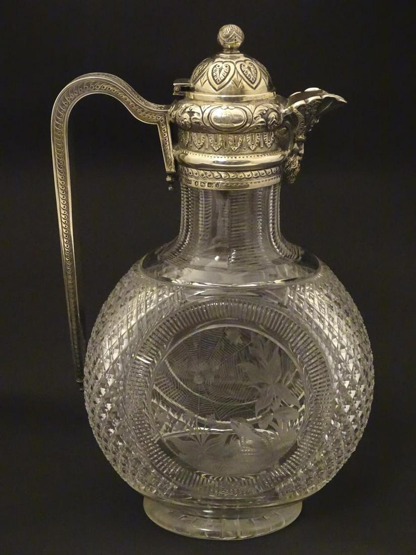 Manner of Thomas Webb : A Victorian cut glass and: Manner of Thomas Webb : A Victorian cut glass and silver mounted claret jug, the body of the jug decorated with scene depicting a frog sat beside toadstools watching a spider on web to one side and sc