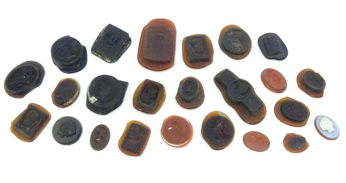 A quantity of assorted intaglio seals etc depicting: A quantity of assorted intaglio seals etc depicting various classical busts etc The largest approx 1 1/2" high (24)