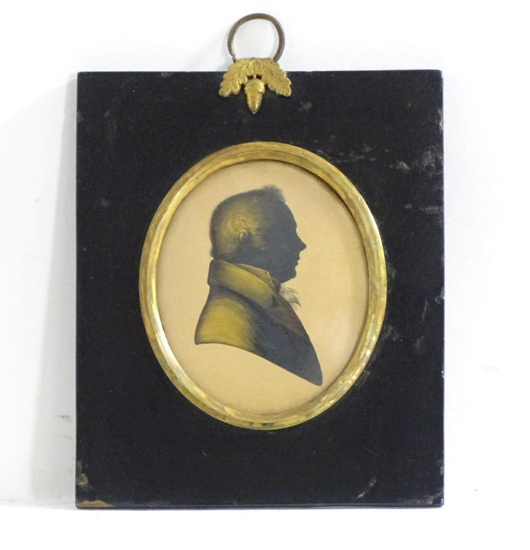 A 19thC oval silhouette portrait miniature depicting a (1 of 3)