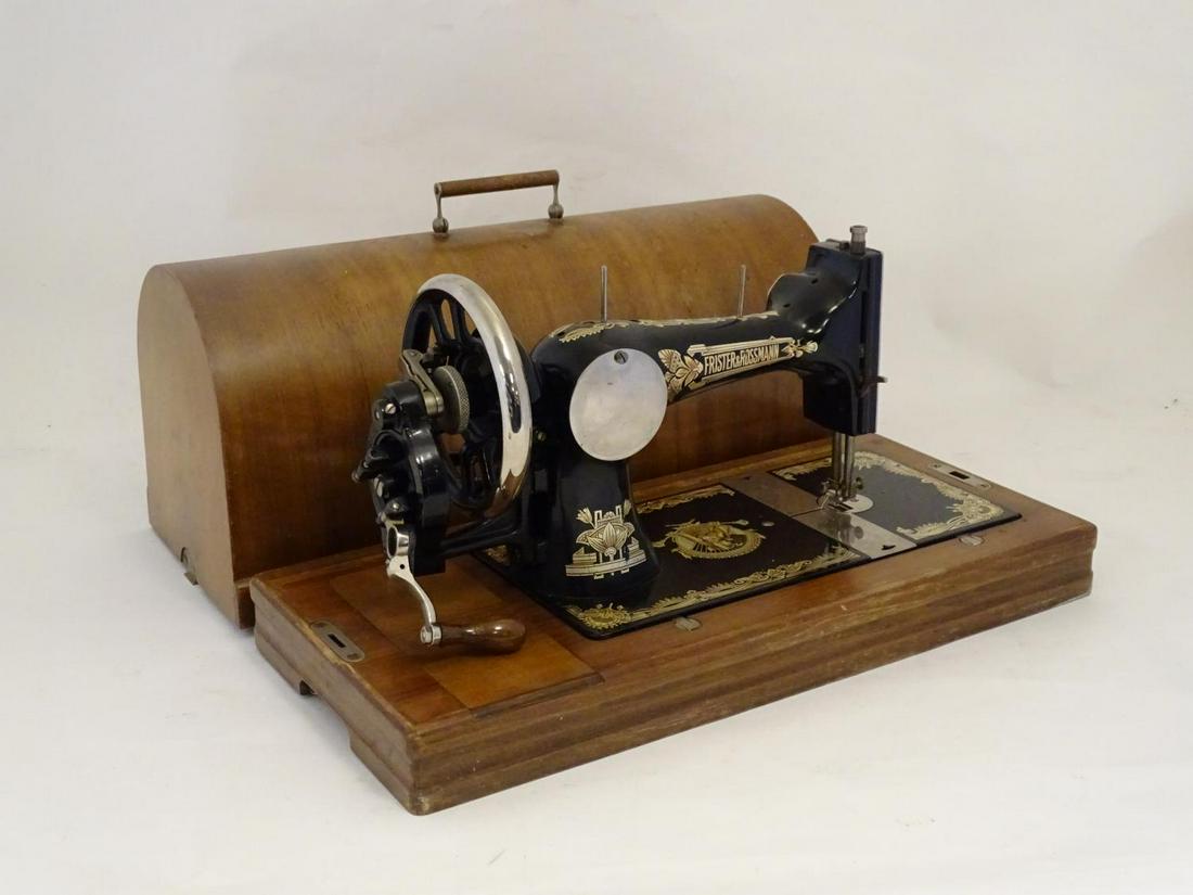 An early 20th Frister & Rossman vibrating shuttle: An early 20th Frister & Rossman vibrating shuttle sewing machine, in a walnut case, approximately 20" long
