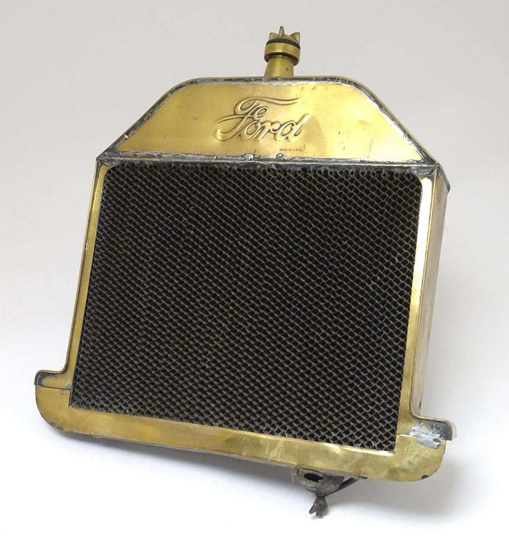 A c1909 Ford Model T radiator, of brass and steel: A c1909 Ford Model T radiator, of brass and steel construction, 23" wide Category Classic Cars & Motorcycles