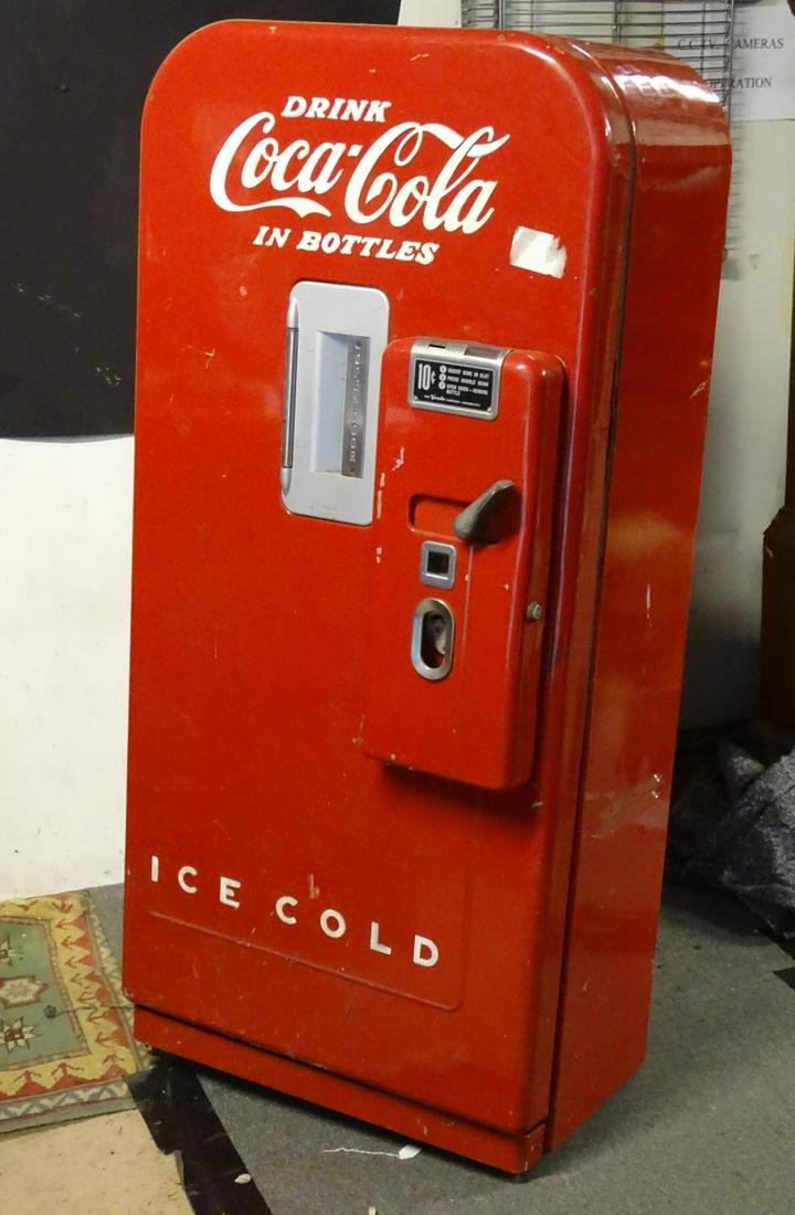 Vintage Retro, mid century: a 1950s advertising Vendo: Vintage Retro, mid century: a 1950s advertising Vendo model 39 Coca Cola / Coke dispensing refrigerator machine. 27 wide, 19 deep 58 tall Category Advertising