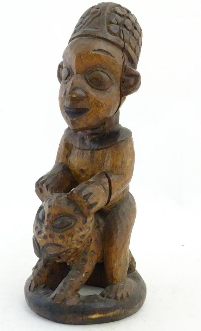 Ethnographic / Native / Tribal: A carved African figure (1 of 6)