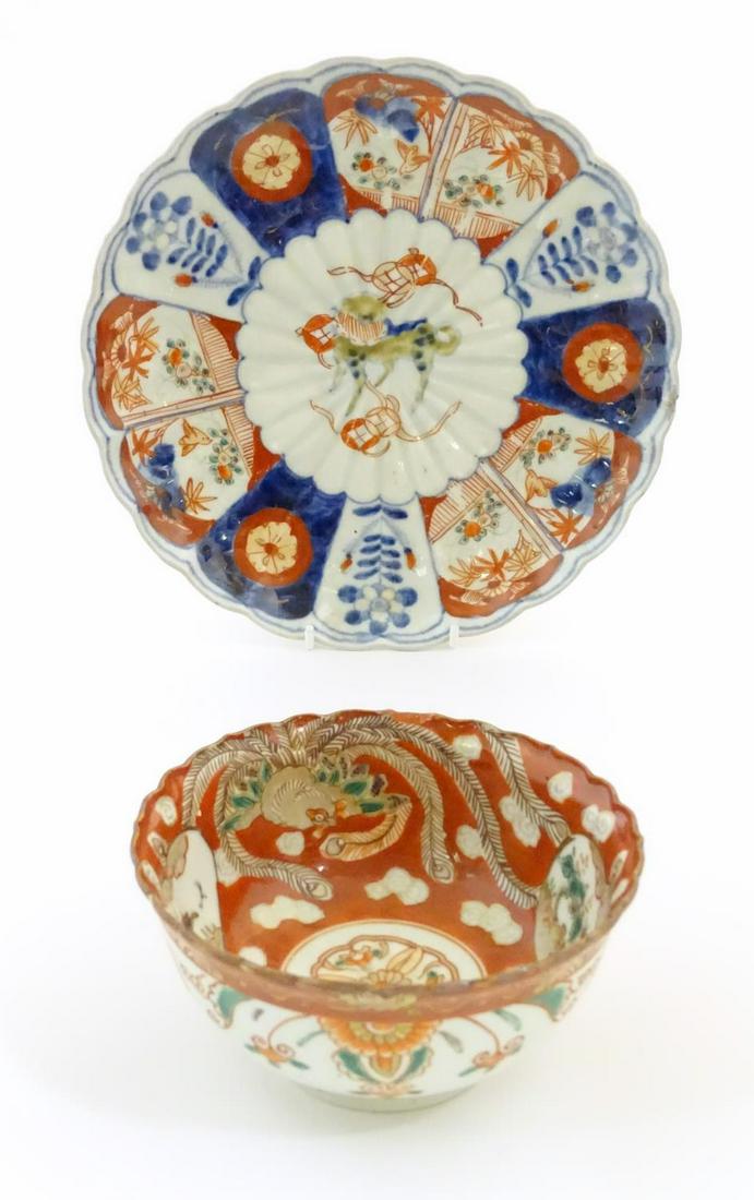 An Oriental plate in the Imari palette decorated with (1 of 7)