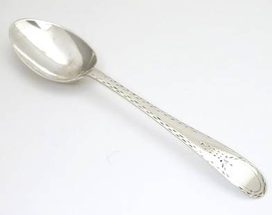 A George III silver Old English pattern teaspoon with: A George III silver Old English pattern teaspoon with bright cut decoration, hallmarked London c. 1780, maker Hester Bateman. Approx. 5" long