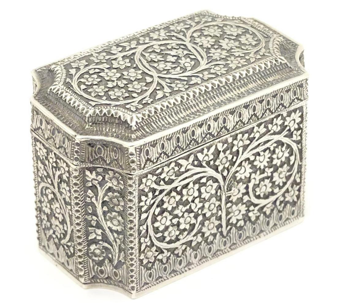A white metal table box of shaped form with floral and (1 of 7)