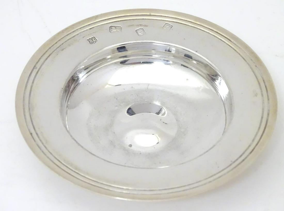 A silver pin dish formed as a miniature Armada dish,: A silver pin dish formed as a miniature Armada dish, hallmarked London1972, maker Richard Comyns. Approx. 4" diameter