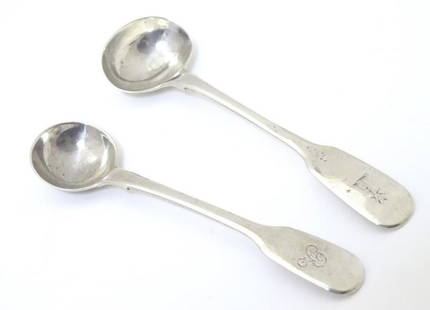 Two 19thC fiddle pattern salt spoons, one hallmarked: Two 19thC fiddle pattern salt spoons, one hallmarked London 1919, maker William Eaton, the other hallmarked London 1824, maker William Traies. Largest approx. 4" (2)