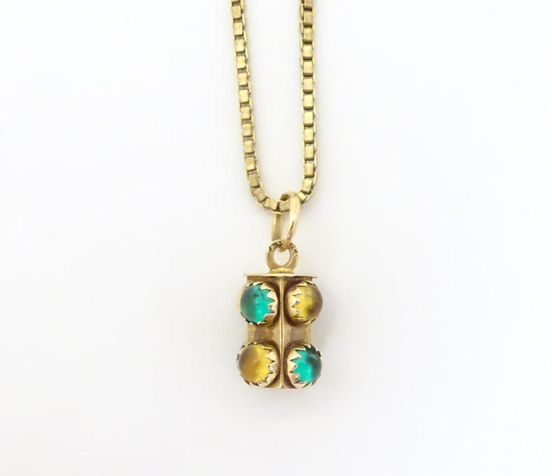 A 9ct pendant set with green and amber citrine cabochon (1 of 10)