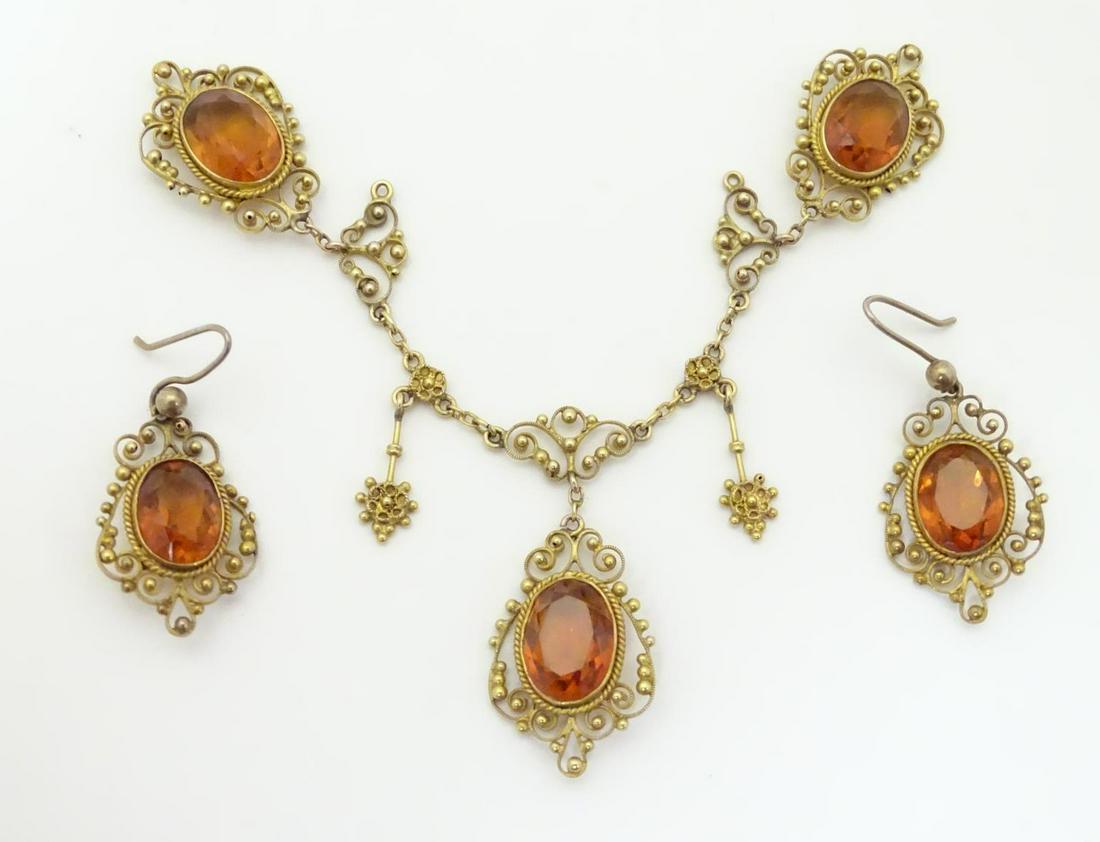 A pair of gilt metal drop earrings set with facet cut (1 of 10)