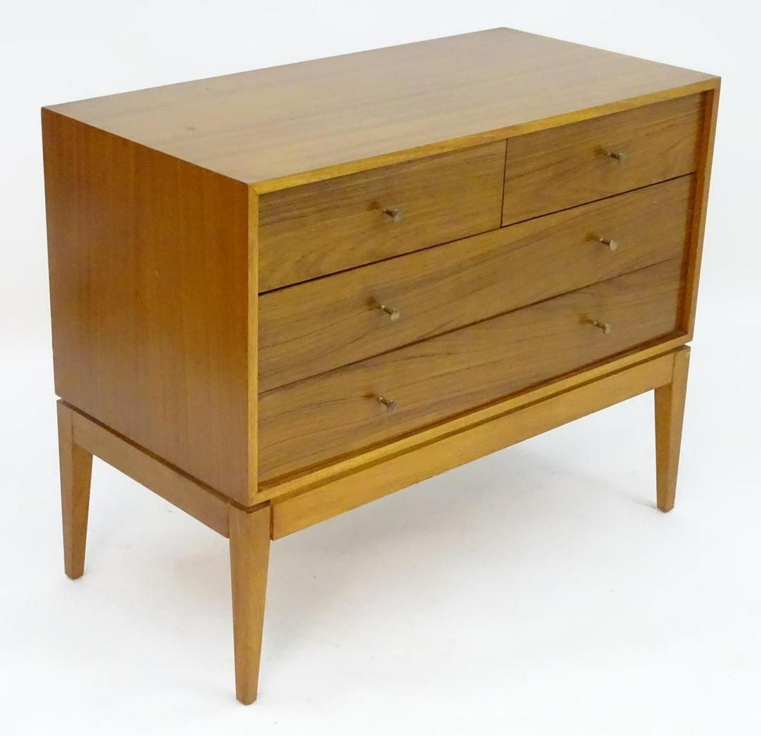 Vintage retro, Mid-century : A 1950-60s Danish inspired: Vintage retro, Mid-century : A 1950-60s Danish inspired teak chest of drawers believed to be designed by Peter Hayward for Uniflex (London) with brushed brass circular handles and raised with rectangu