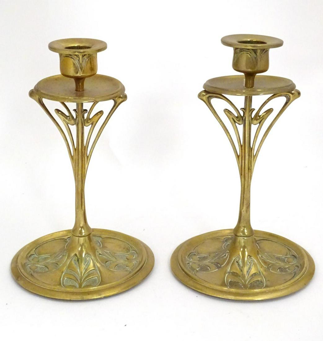A pair of Art Nouveau brass candlesticks with tendril (1 of 7)