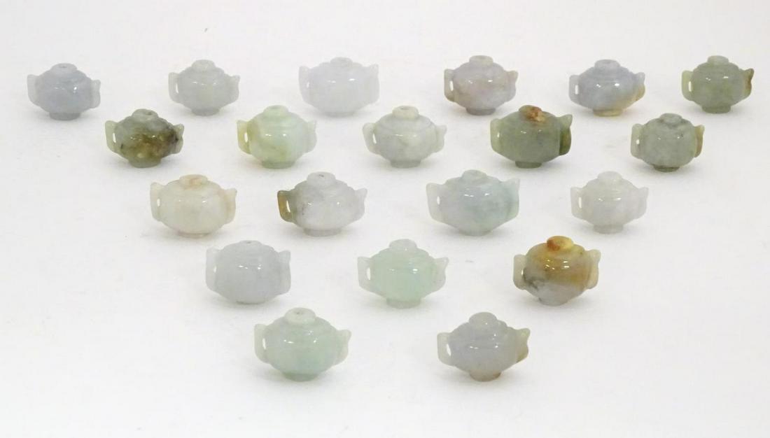 A quantity of Oriental hardstone beads modelled as twin: A quantity of Oriental hardstone beads modelled as twin handled vases / teapots. Approx. 1 1/8" x 7/8" (20)