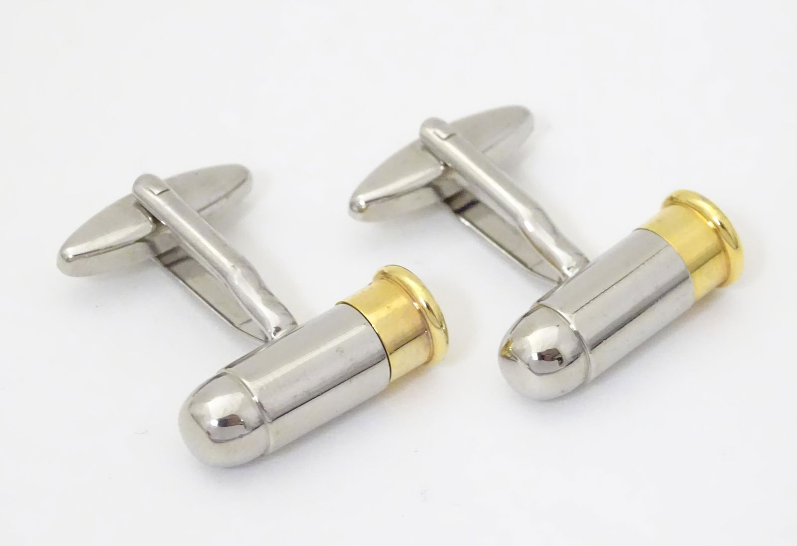 A pair of cufflinks formed as bullets / cartridges: A pair of cufflinks formed as bullets / cartridges