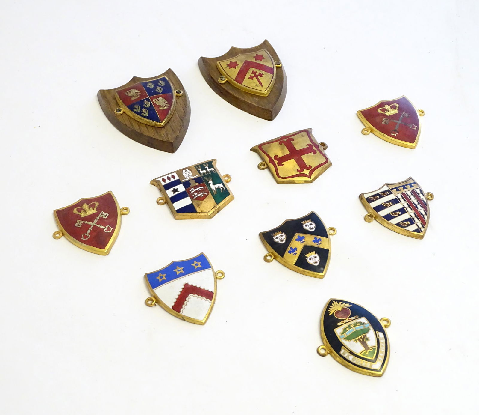 A collection of gilt metal enamelled collegiate (1 of 6)