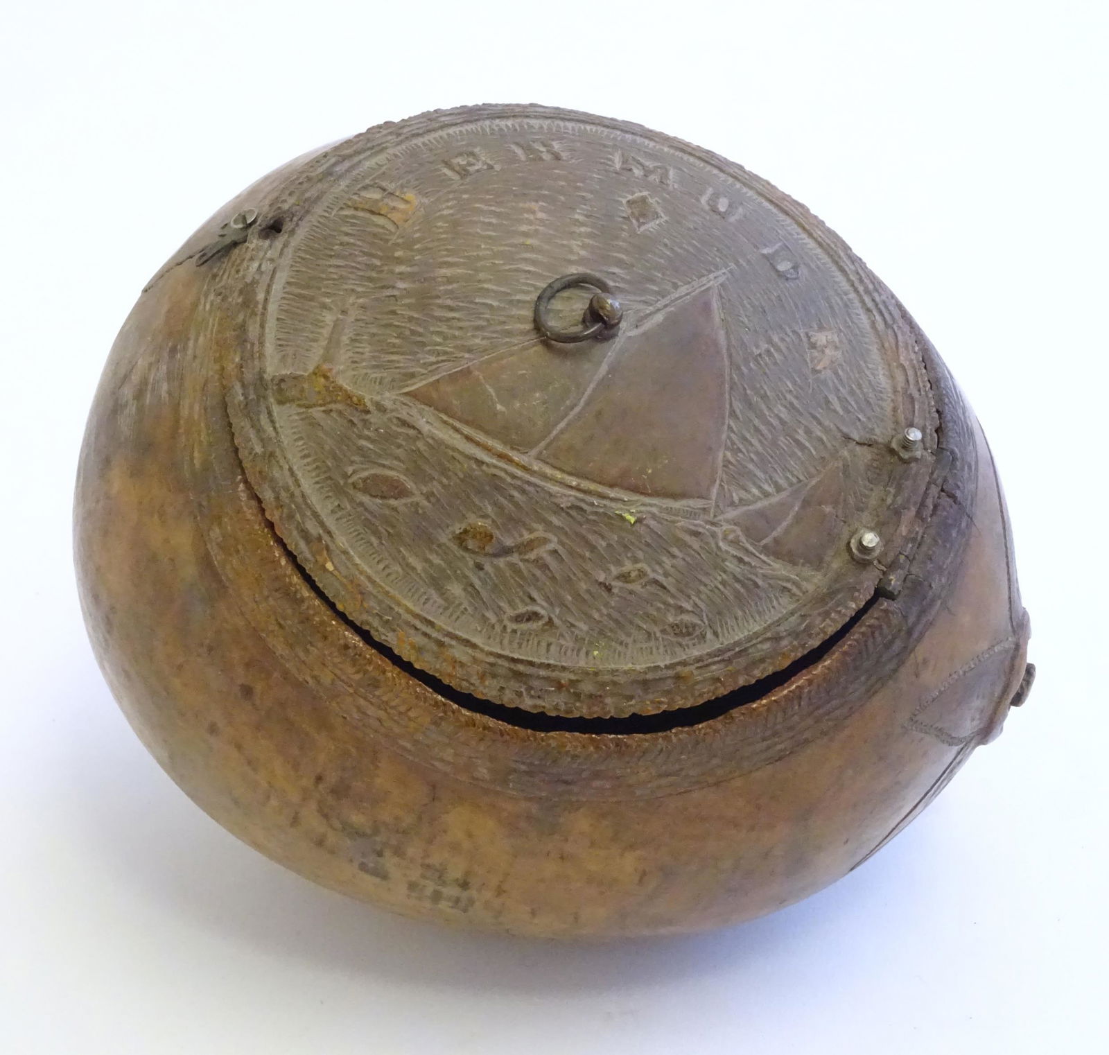 A 19thC carved coconut with a hinged lid decorated with (1 of 7)