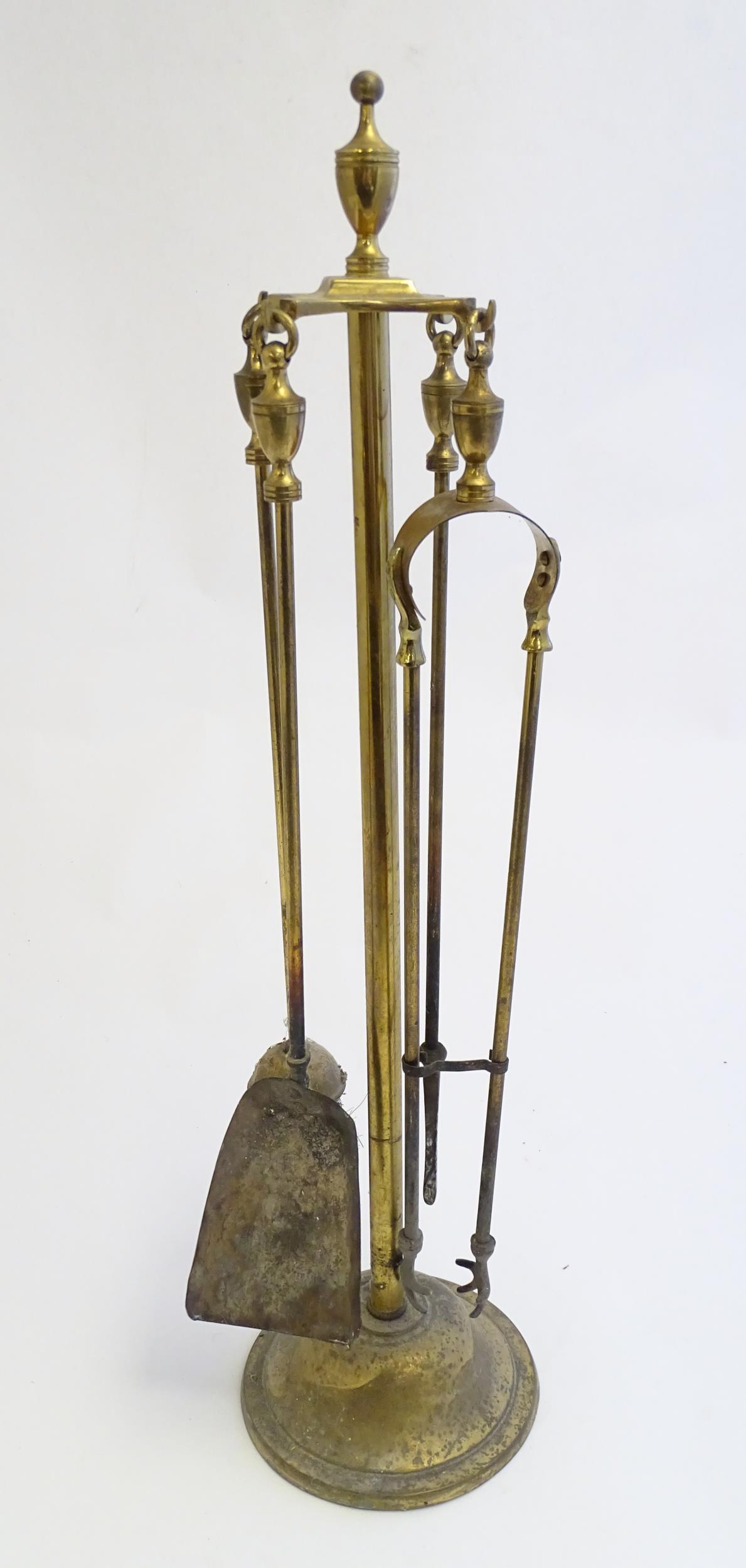 A 20thC brass fireside companion set / fire tools, (1 of 7)