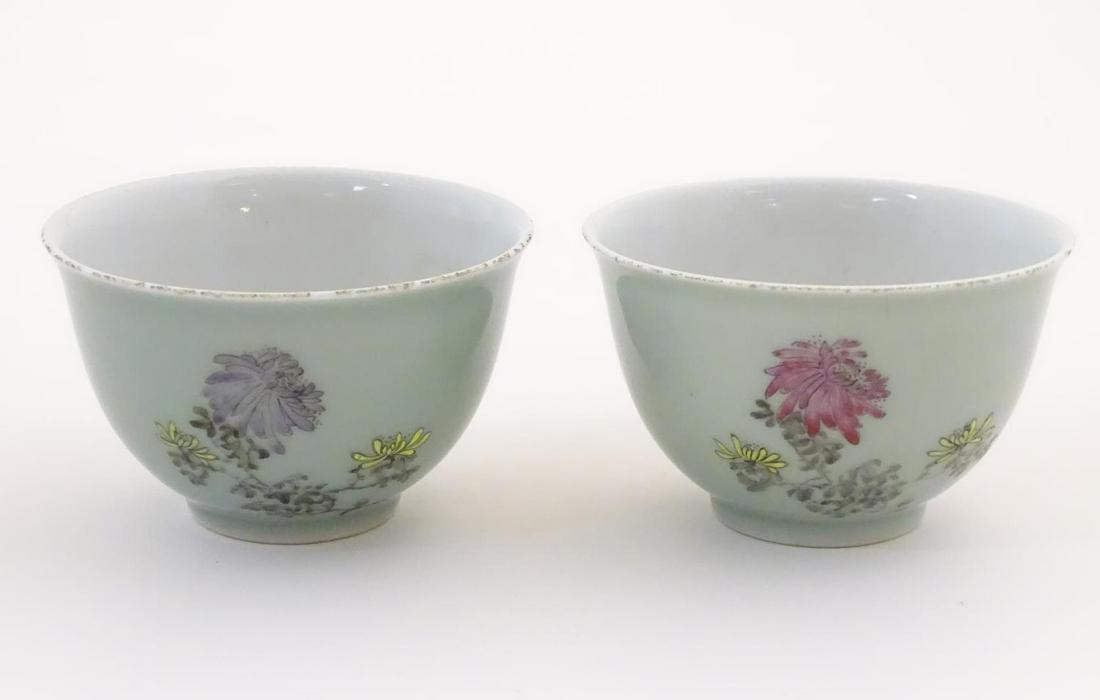 A pair of Chinese tea bowls decorated with flowers and (1 of 7)