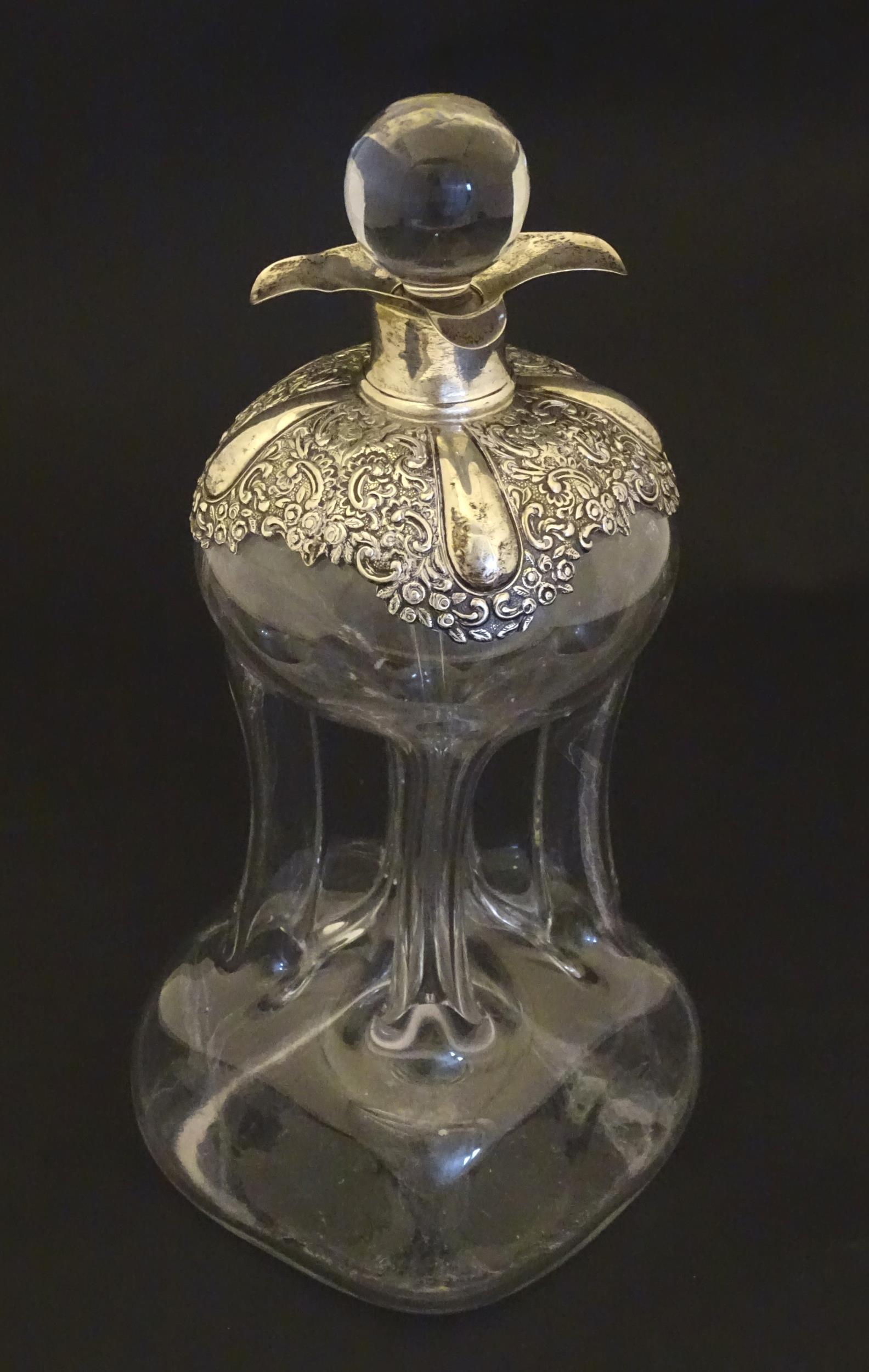 An early 20thC glass decanter with pinched waist detail (1 of 7)